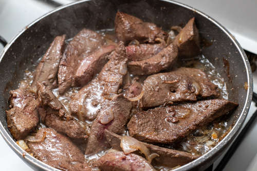 beef liver cooked in a pan