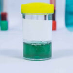 green urine sample in a laboratory